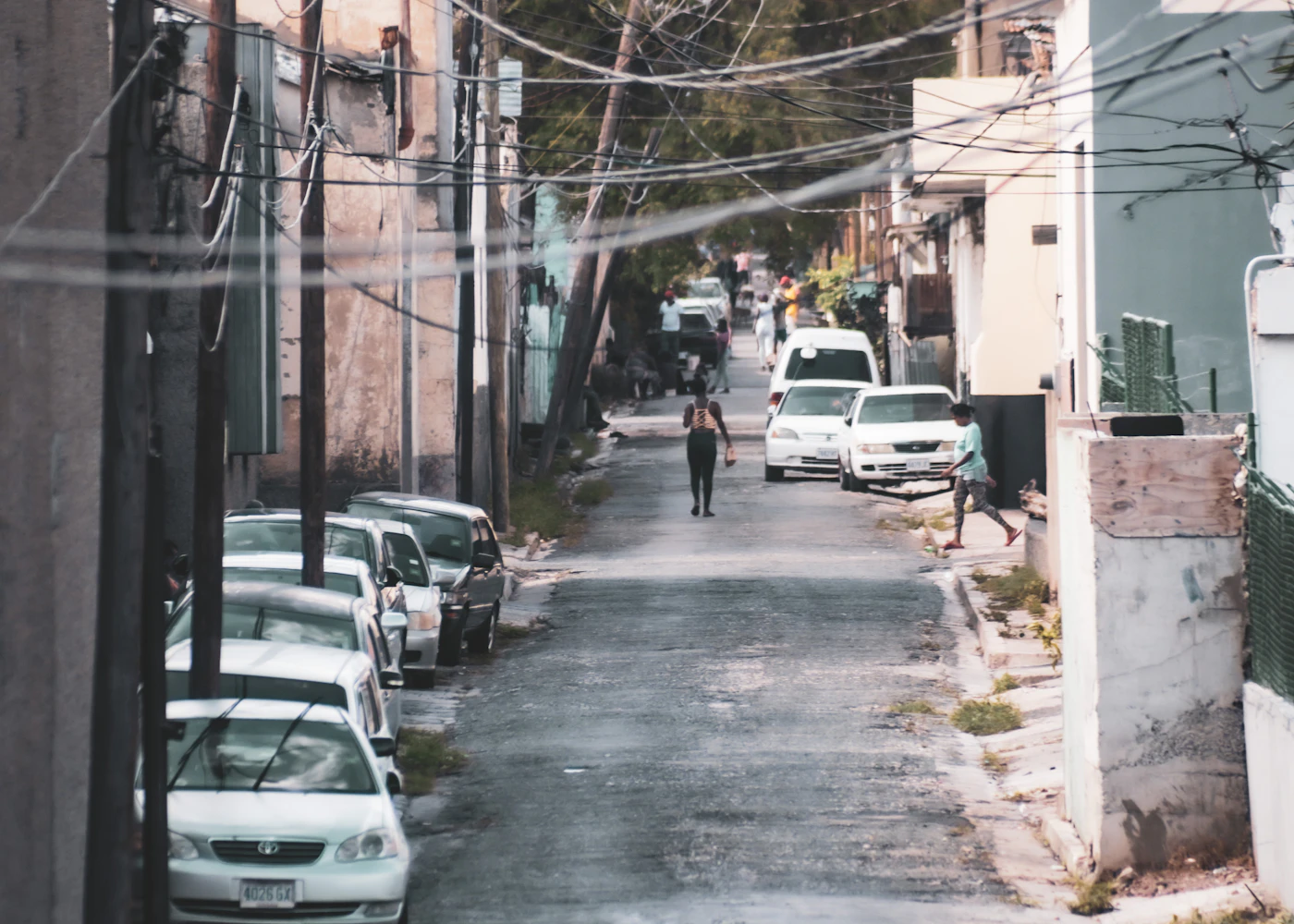 Buildings and parked cars along a street in Kingston, Jamaica