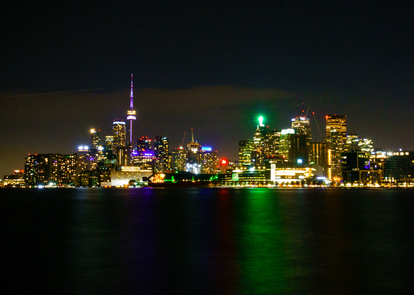 Toronto’s illuminated skyline and CN Tower across the water